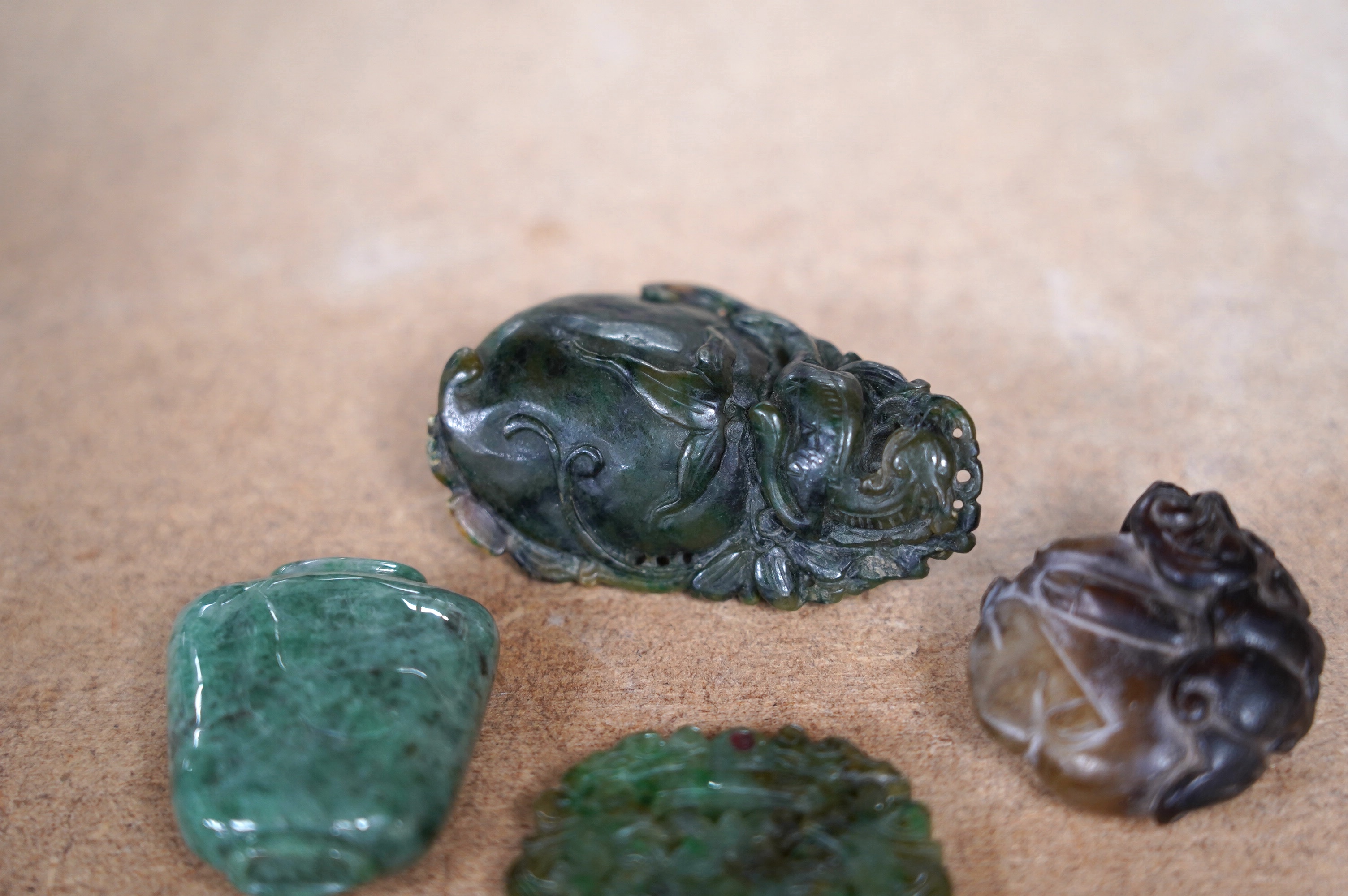 Four Chinese carvings including jade. Condition - fair to good